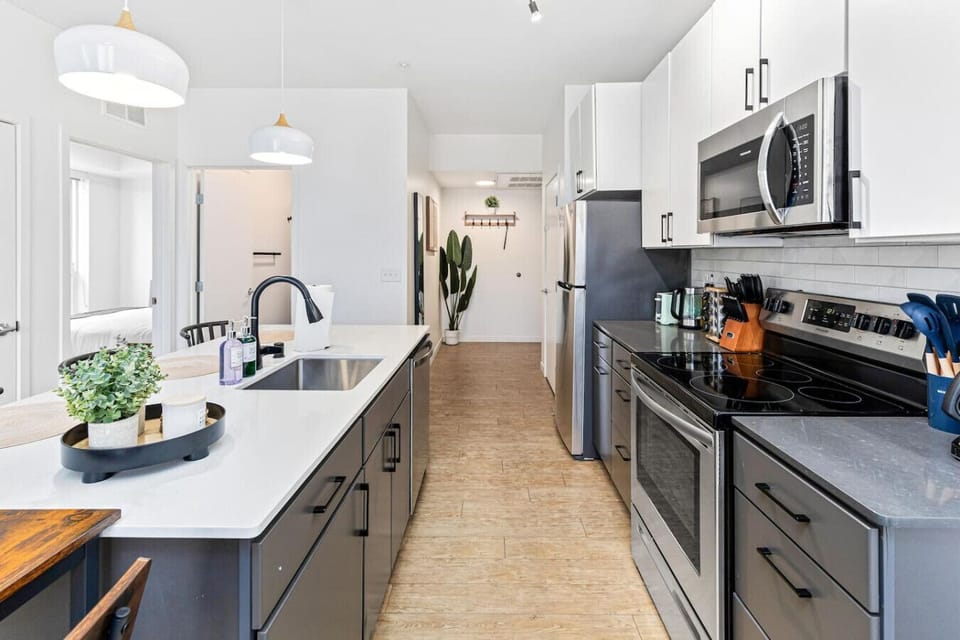Kitchen: Sleek design meets functionality—prepare culinary delights in style!