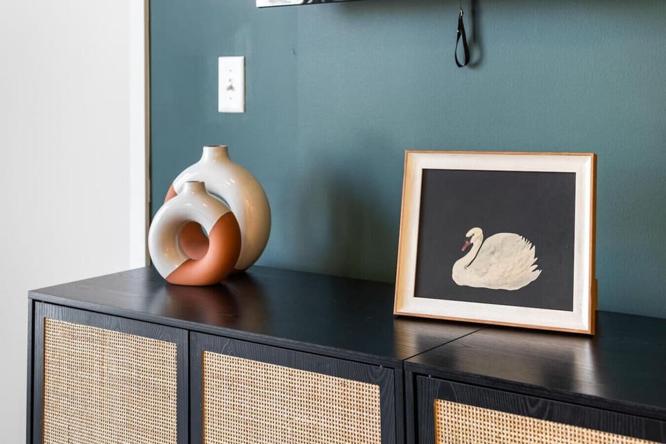 Living Room: Modern accents shine with vibrant decor, inviting relaxation and creativity!