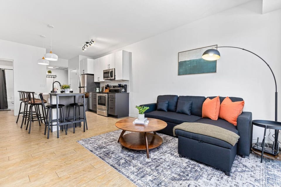 Living Room: Sleek design with modern furnishings, a vibrant atmosphere, and great space for fun gatherings!