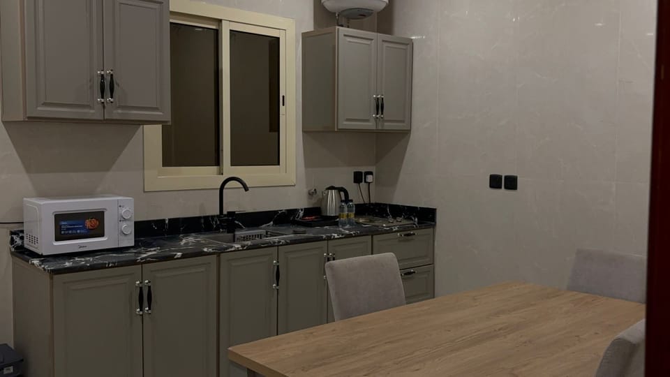 Deluxe Apartment | Private kitchen | Fridge