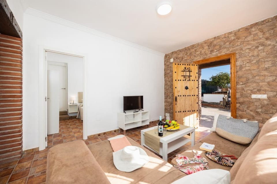 Living room with sofa, WiFi internet, and satellite TV