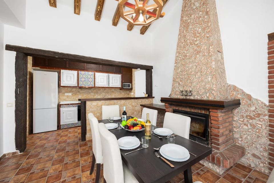 Dining area with ornamental fireplace
