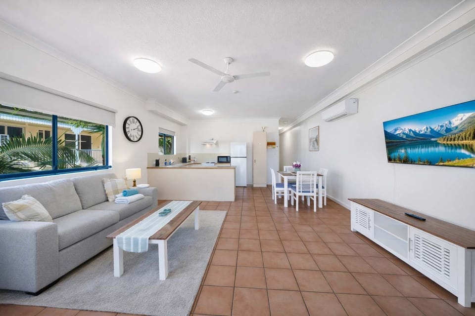 Spacious living area with seating and natural light