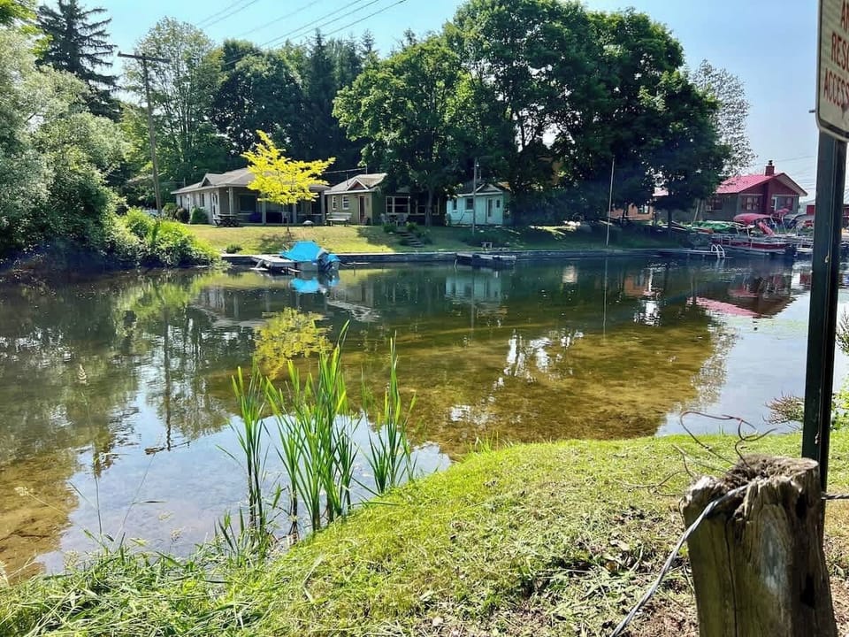 Walk in kayak spot, 100 feet from the property. Boat rentals across the water (can walk there over the bridge).