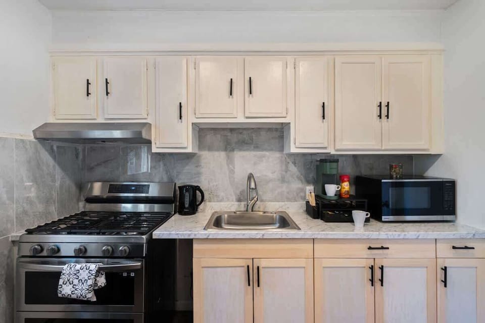 Modern convenience meets simple charm—brew your morning coffee, warm a quick meal, or cook a family favorite with ease.