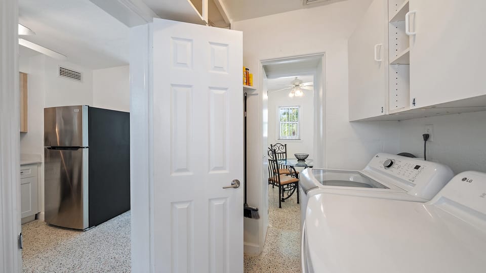 The laundry room provides locked door access to the second 2 bedroom/1 bath villa.