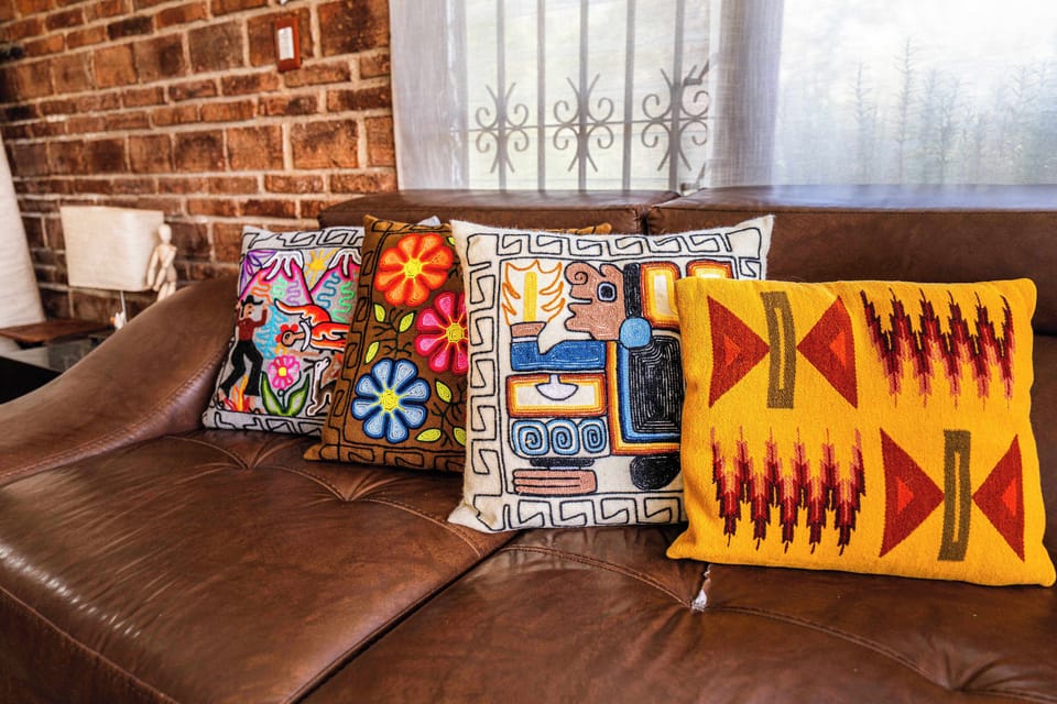 Living Room | Handwoven pillows, local craft, room to settle in