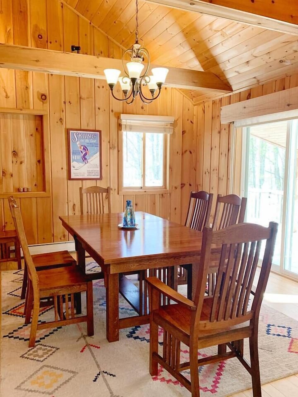The dining table sits 6-8 people with an expandable leaf.