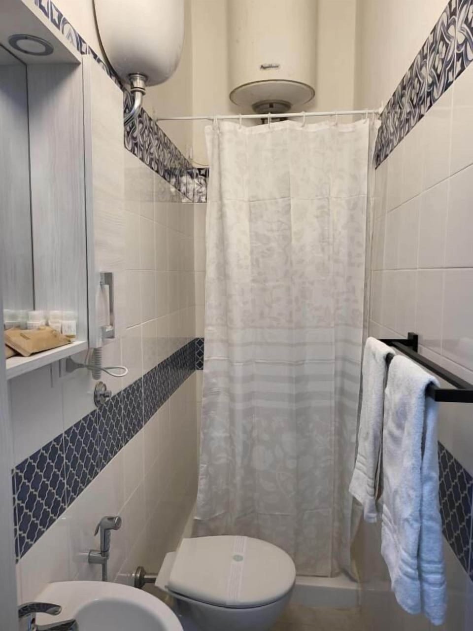 Shower, hair dryer, slippers, towels