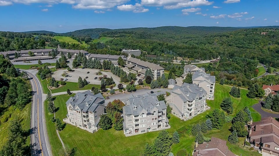 Expansive aerial view showcasing The Villages’ scenic setting amid rolling hills and endless natural beauty.