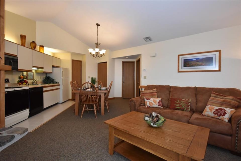 Open-concept layout combining kitchen and living area, offering comfort and convenience for your getaway.