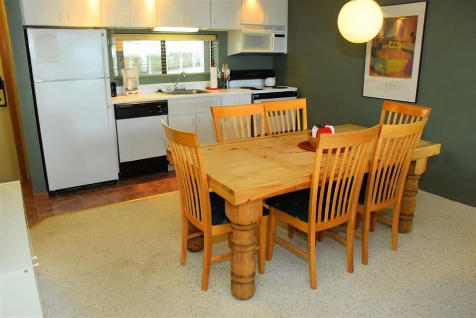 Bright dining area where laughter flows easily, creating the perfect setting for shared meals and mountain memories.