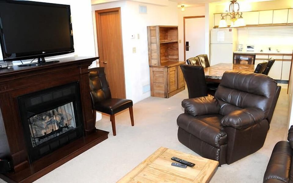 Inviting fireside lounge with a warm alpine glow, setting the tone for easy conversation and cozy nights in.