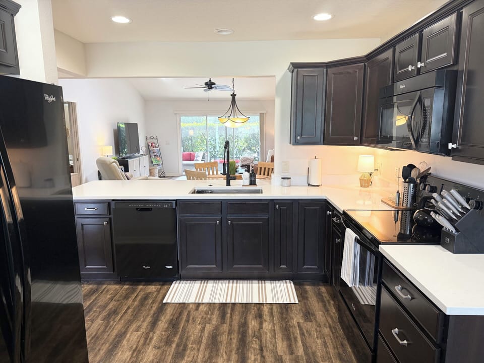 Open kitchen concept with views into the living room and lanai