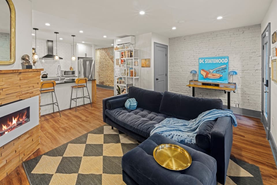 Throw blankets and an electric fireplace for cozy fall and winter evenings