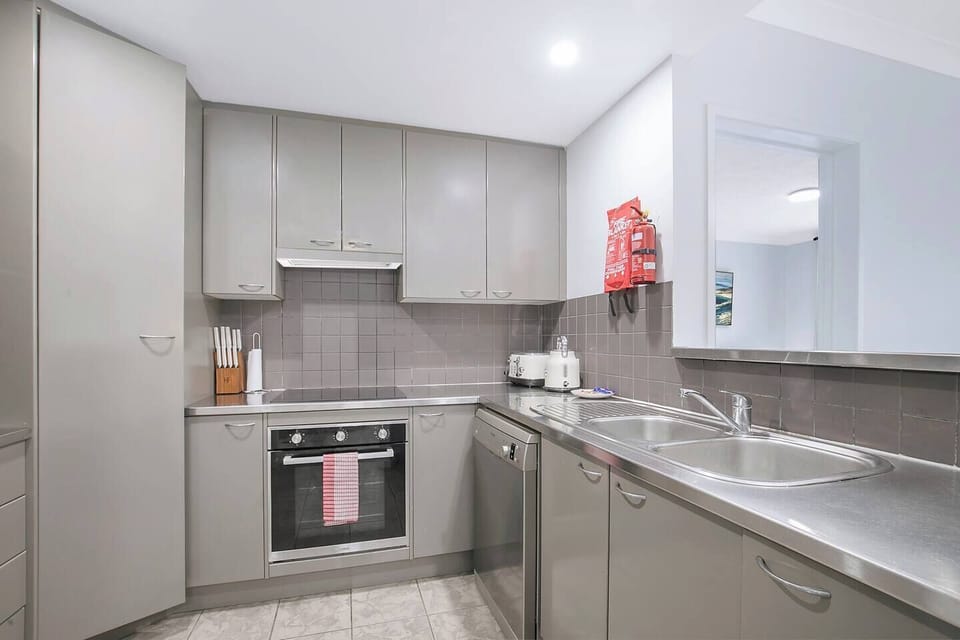 A sleek, fully equipped kitchen with stainless-steel appliances and all cooking basics makes meal preparation effortless for family dinners or morning coffee rituals.
