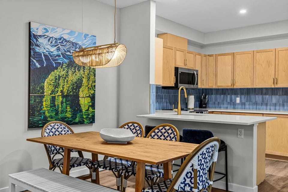 Contemporary art elevates the space — each piece chosen for colour, mood, and visual impact