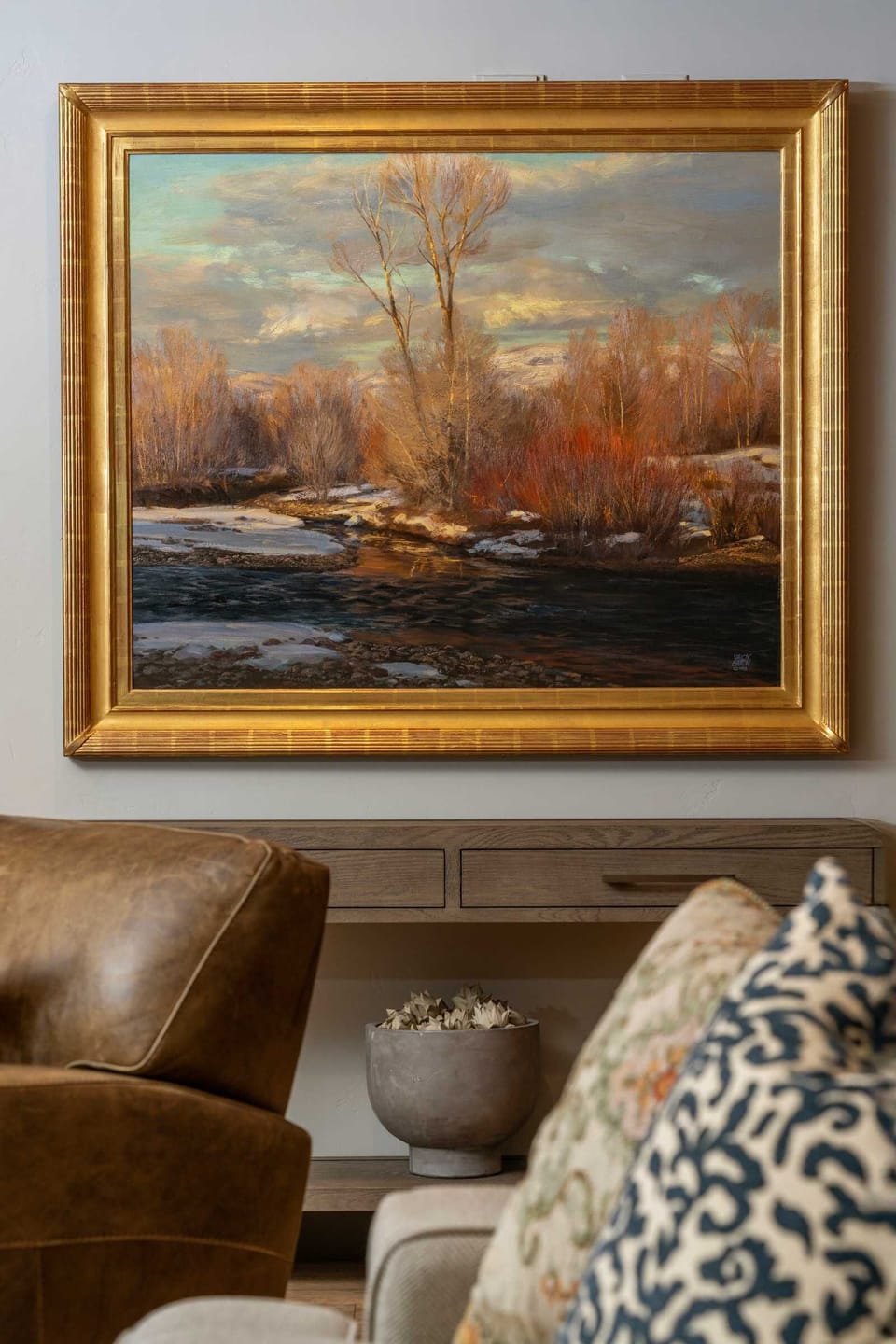 Stunning local art of western landscapes bring warmth and color to the upstairs.
