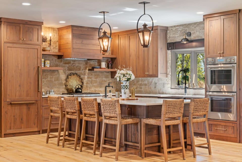 Chef’s kitchen with warm wood finishes and high-end appliances - as beautiful as it is functional.