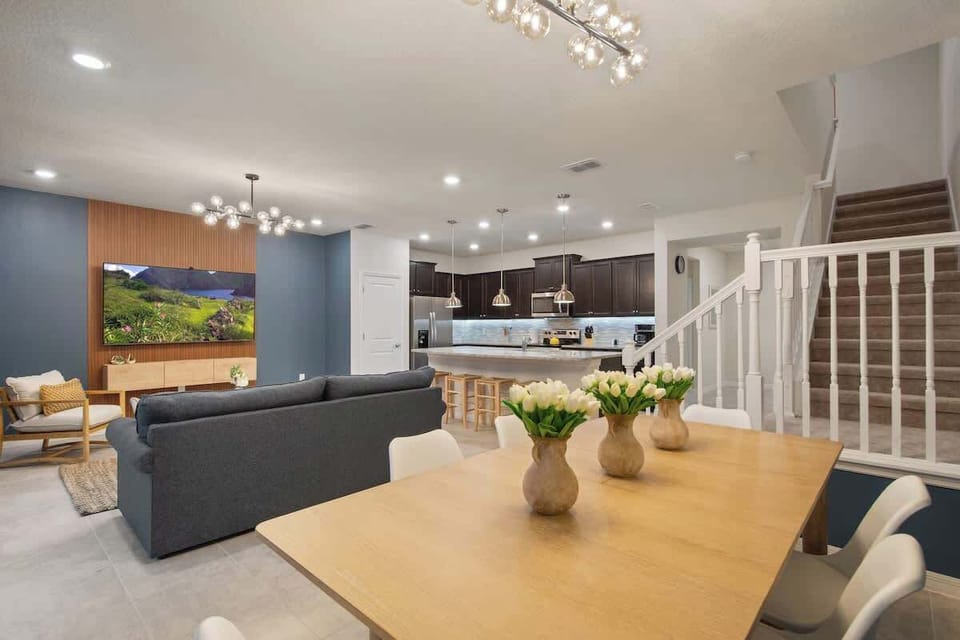This bright and modern living space invites everyone to unwind together. Enjoy comfortable sofas, elegant décor, and seamless indoor-outdoor flow—ideal for board games, late-night chats, or relaxing afternoons with loved ones.
