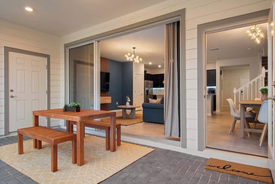 Enjoy a private screened-in pool area featuring comfy loungers, a dining table for outdoor meals, and a BBQ grill perfect for family cookouts. Relax, dine, and make unforgettable memories in this inviting Airbnb outdoor oasis.