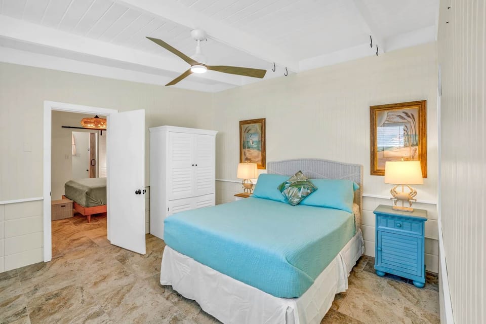 Bedroom 2 with queen size bed and entrance to masters