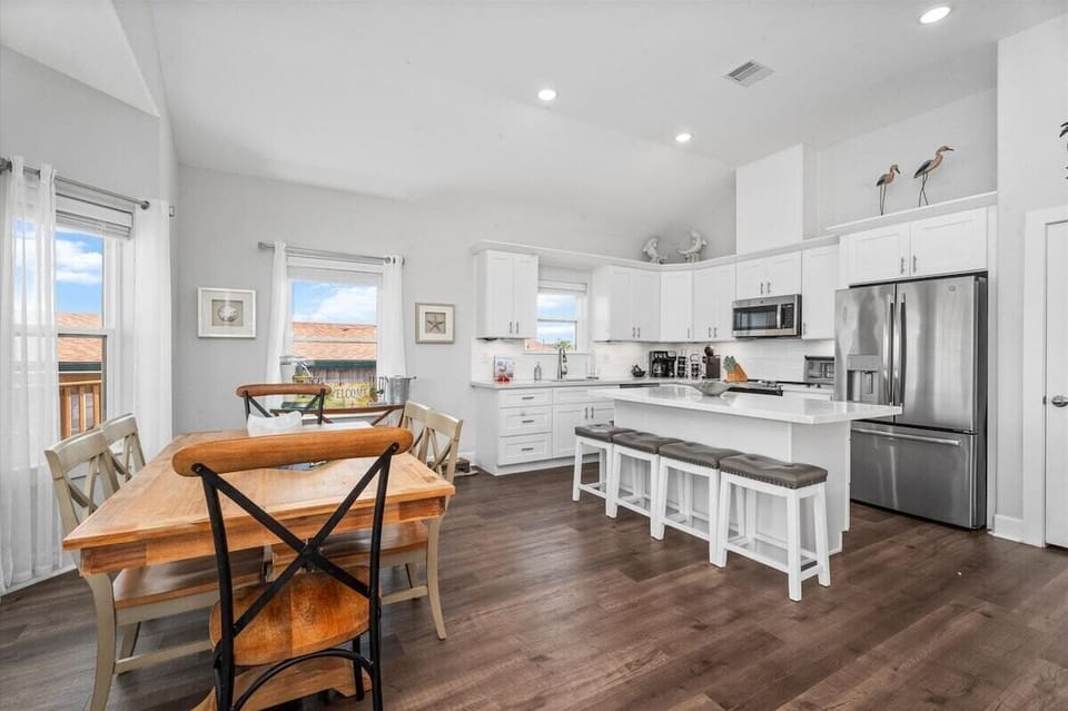 Fully equipped modern kitchen with stainless steel appliances and ample counter space.