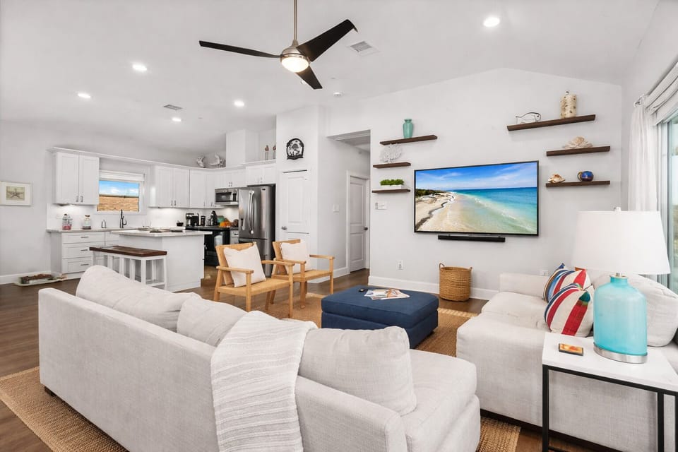 Open concept living area connecting kitchen, dining, and lounge space—perfect for groups.