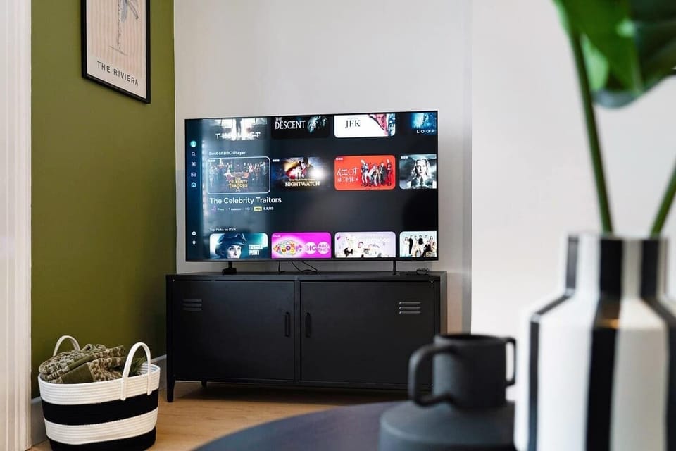 The welcoming lounge combines comfortable furnishings with a Smart TV, offering a relaxing retreat after a day of exploring.