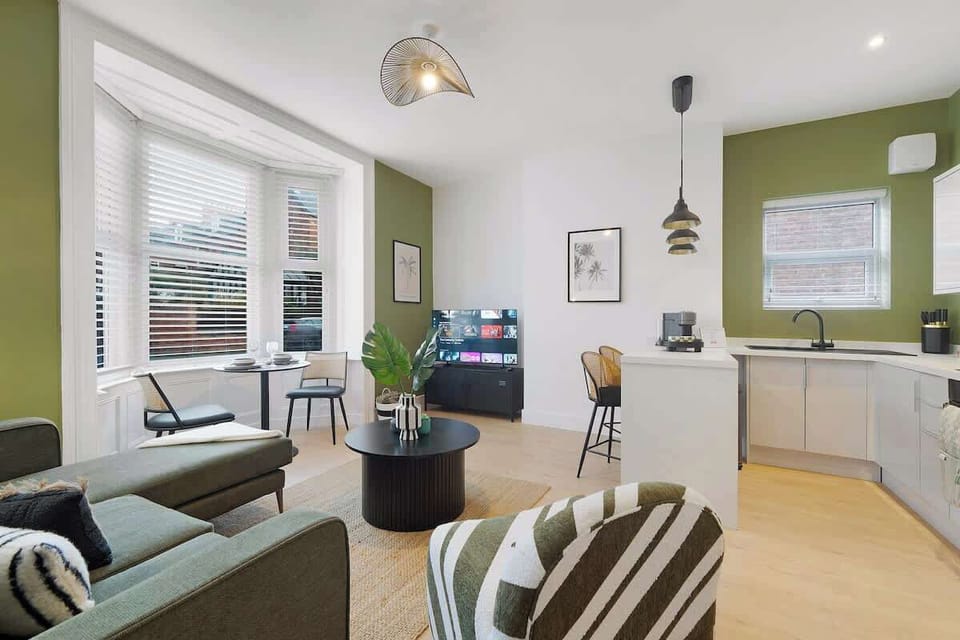 Settle into a spacious living area with a Smart TV and comfortable seating, thoughtfully designed for relaxation and leisure.