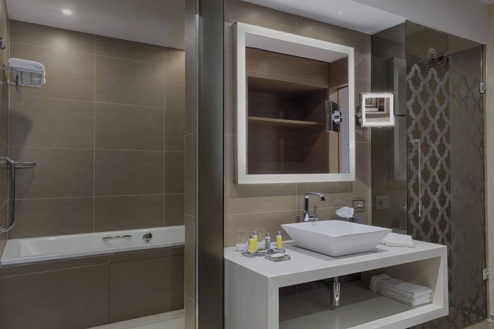 Combined shower/tub, designer toiletries, hair dryer, bathrobes