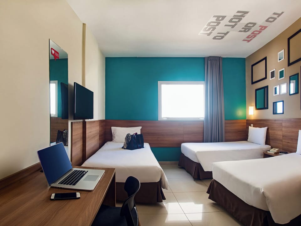 Superior Triple Room | Minibar, desk, blackout drapes, free WiFi