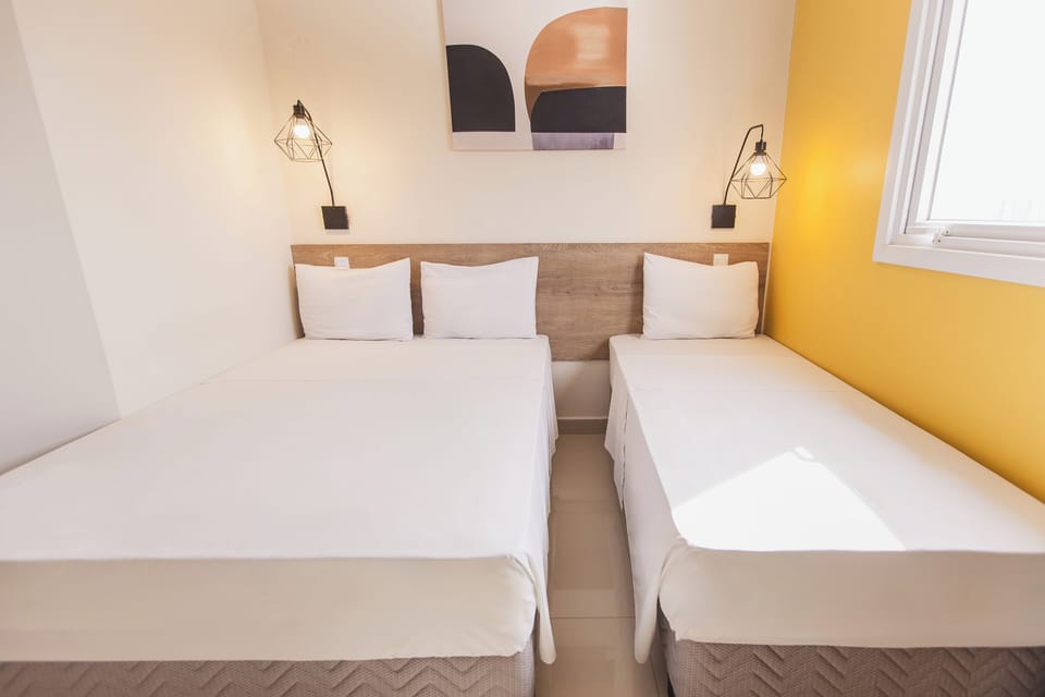 Family Triple Room | Minibar, desk, blackout drapes, soundproofing