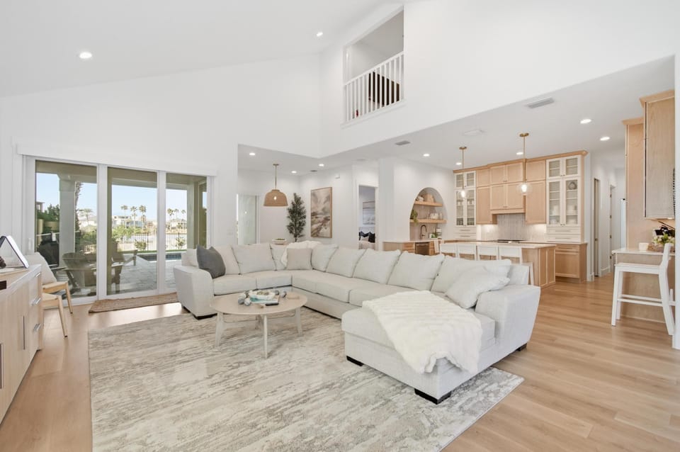 Large main floor gathering space with gourmet kitchen and luxurious furnishings
