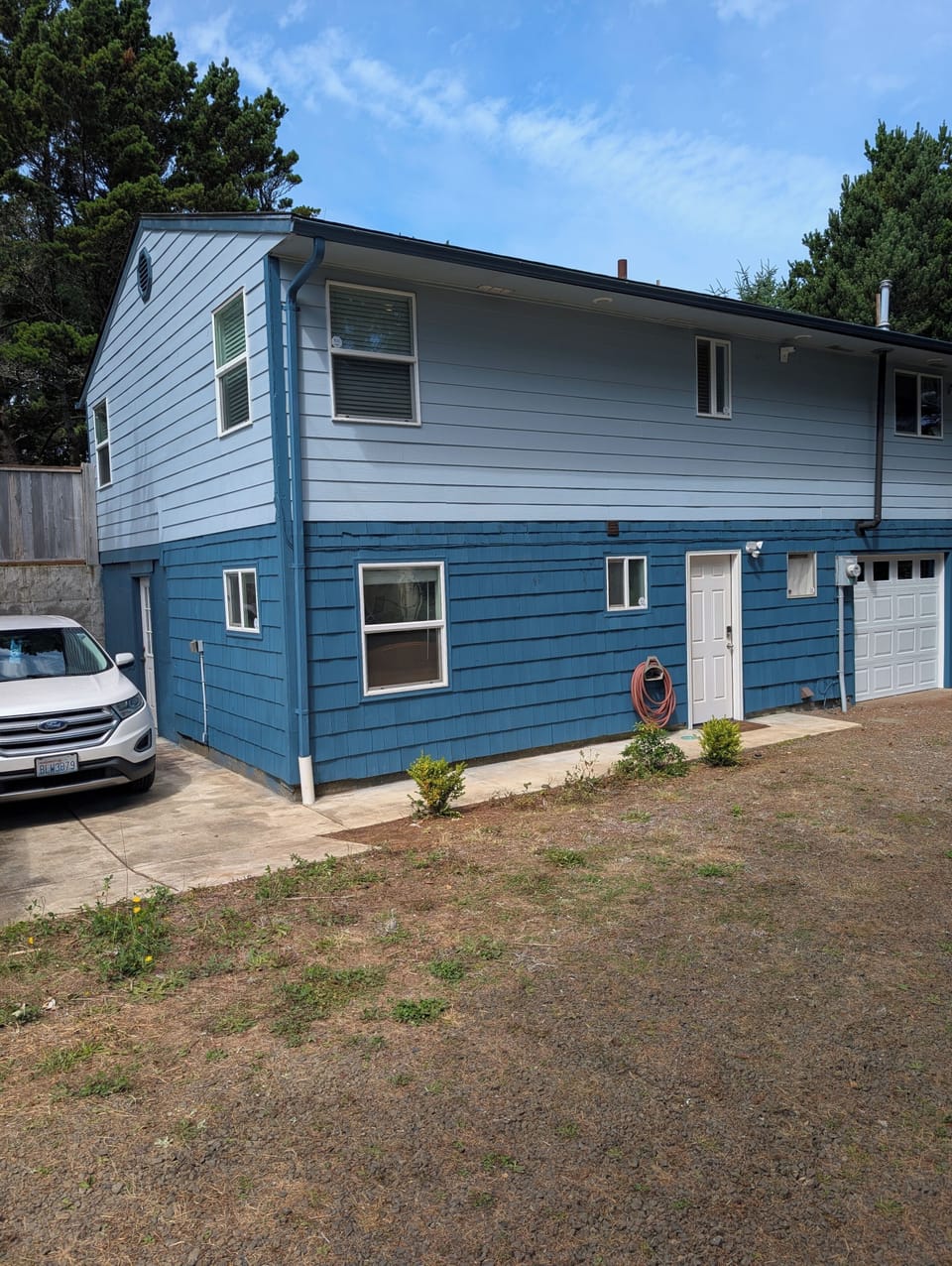 Back of the house - access is on this level at the white door.

