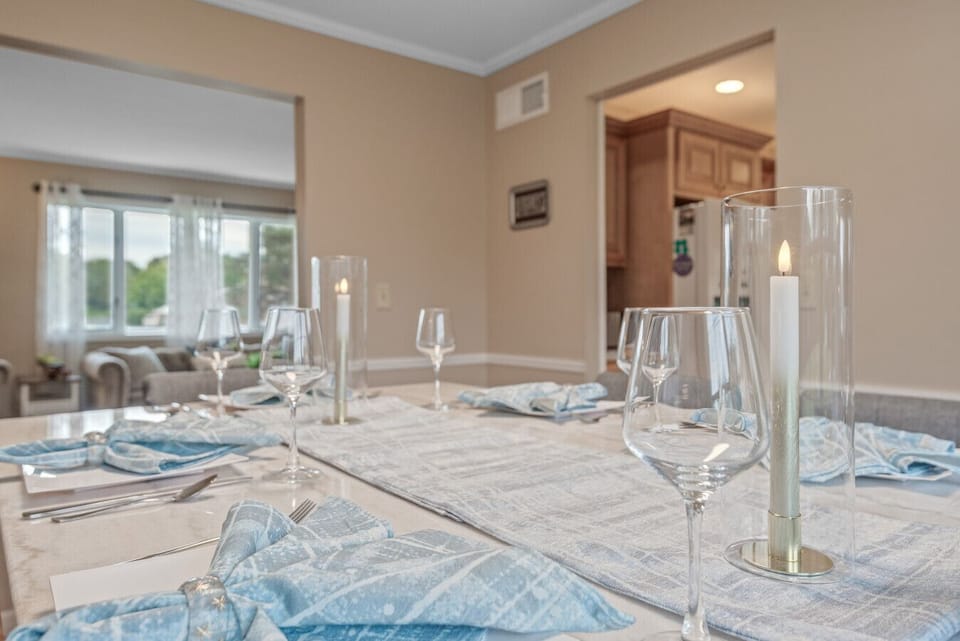 Dining Area | Bright and welcoming with a large table, comfy seating, and natural light.