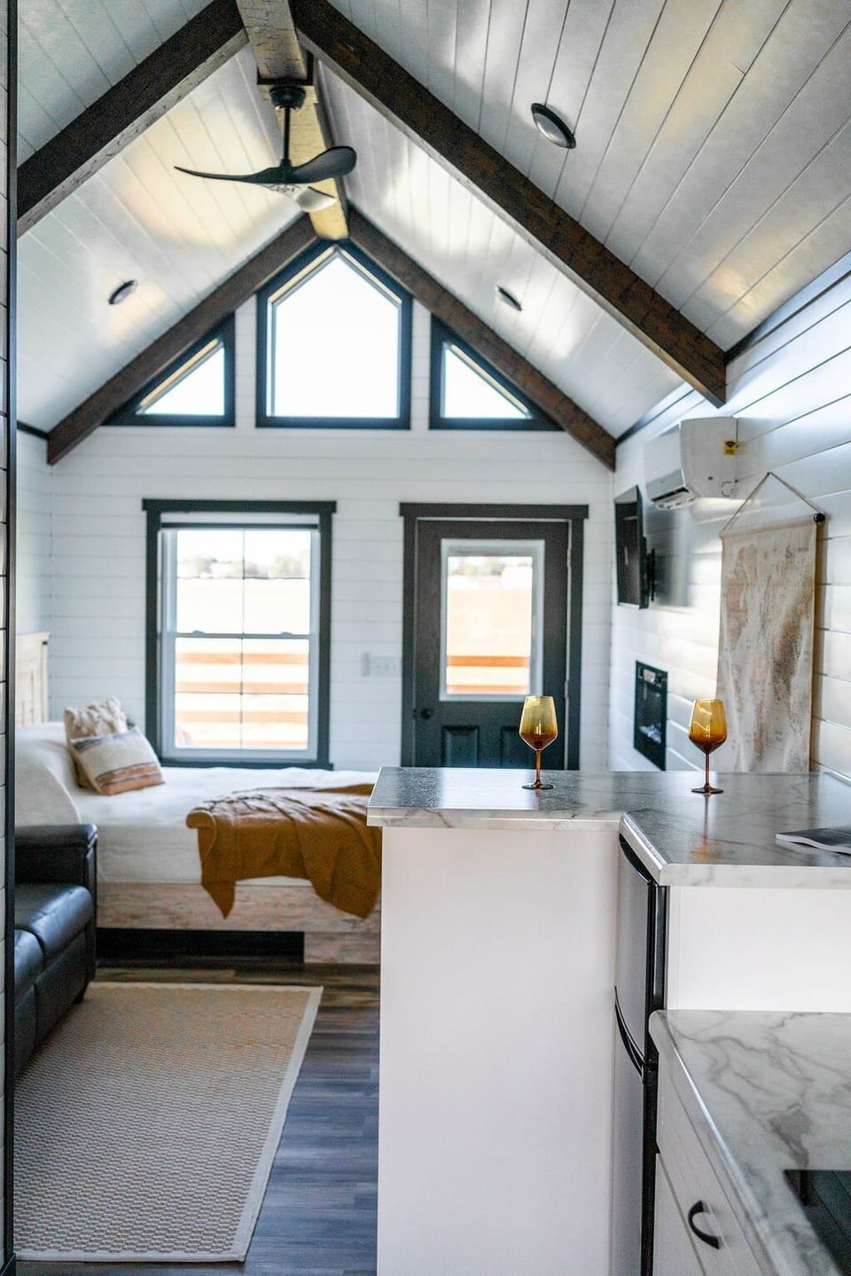 Bedroom - Queen bed with luxury linens, electric fireplace, and TV for cozy, restful evenings