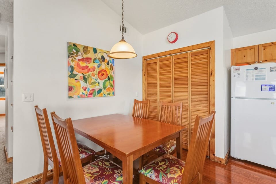 The dining table comfortably seats five, making it perfect for shared meals and evening board games.