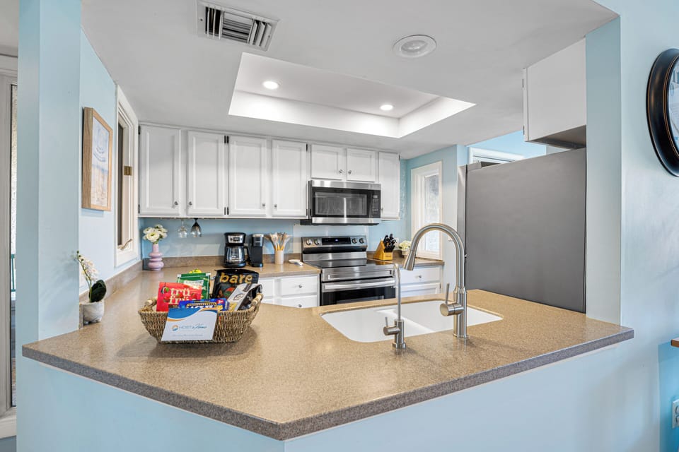 This kitchen is fully equipped with stainless-steel appliances and all the essentials, preparing meals (or just savoring your morning coffee) has never been easier!