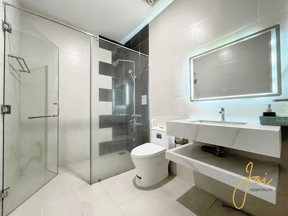Family Room, Balcony, Beach View | Bathroom | Shower, hair dryer, slippers, towels
