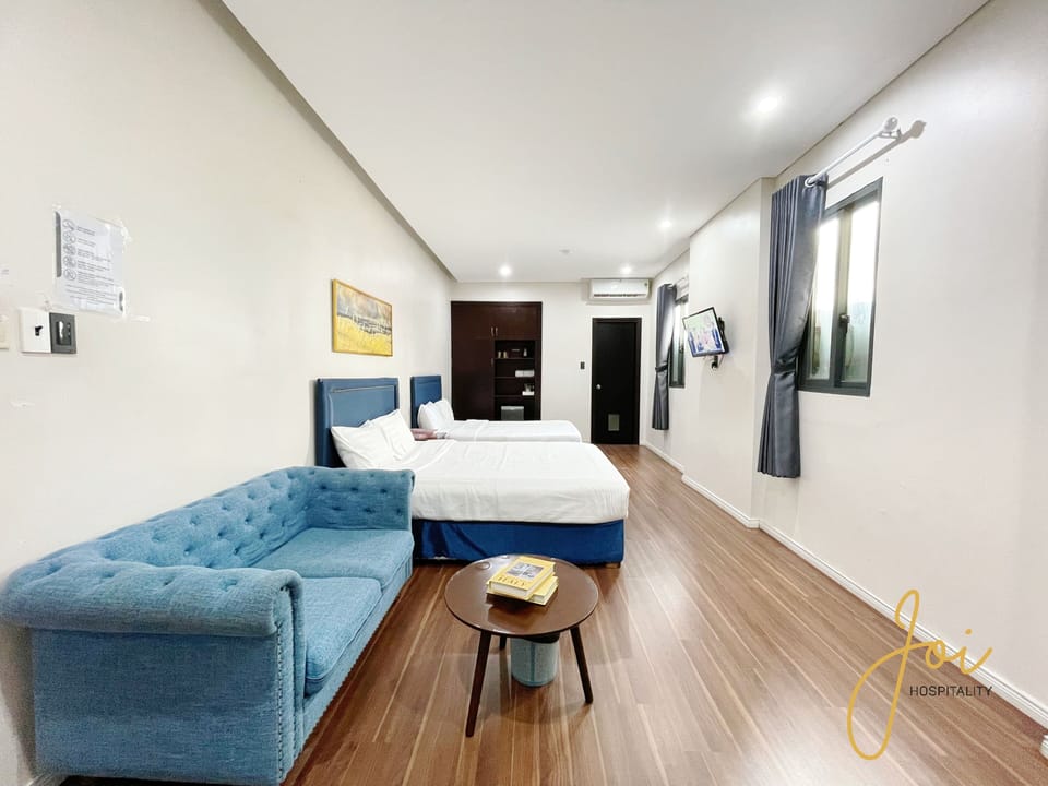 Family Double Room, 2 Queen Beds | Desk, laptop workspace, blackout drapes, iron/ironing board