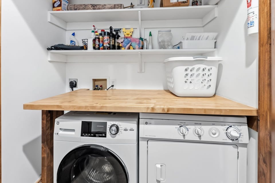 Laundry area [main floor]: Washer and dryer, overhead storage