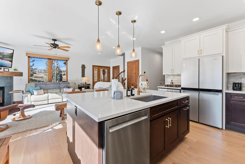 Kitchen [main floor]: Drip coffee maker, KitchenAid appliances, blender, kettle, cooking utensils, tableware