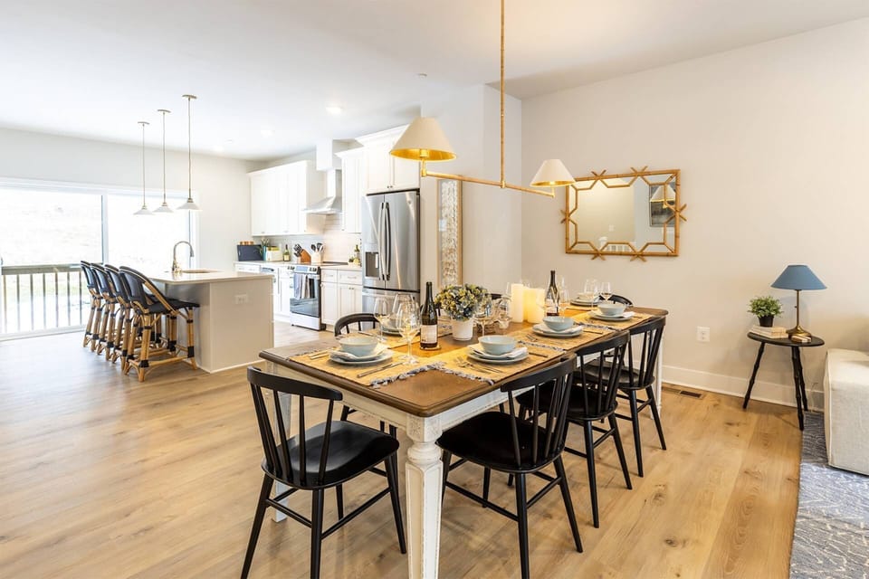 The kitchen opens up to the dining room table with seating for 8-10.