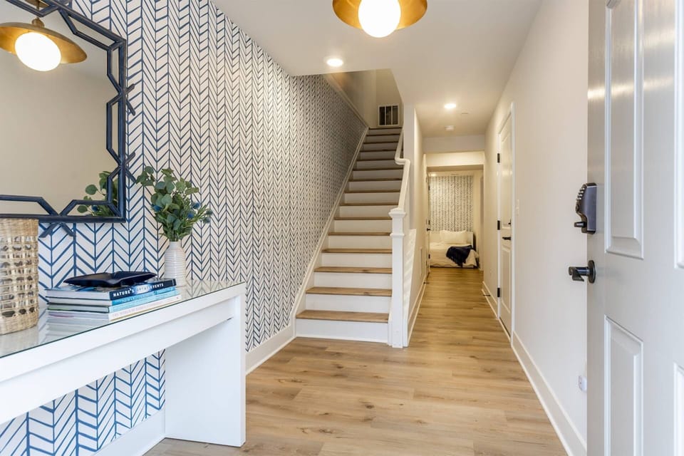 After parking on the driveway, enter the home on the lower level's foyer.
