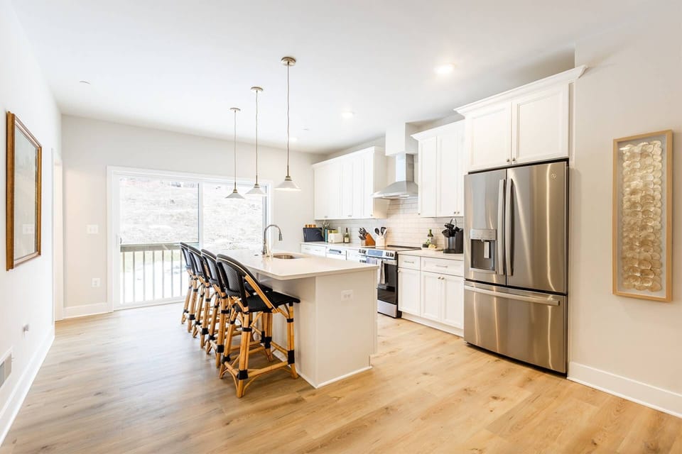 The bright gourmet kitchen is located at the top of the 2nd level stairs.