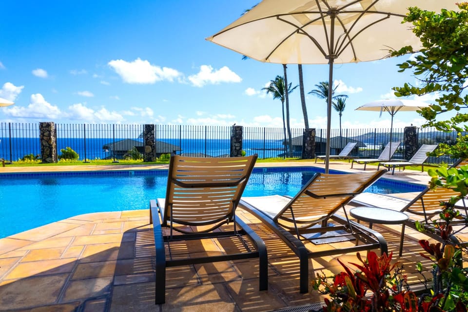 Welcome to Kapalua Bay Villas, a tropical oasis where vibrant gardens and serene beauty welcome you to paradise. Discover your perfect island retreat surrounded by colorful blooms and lush greenery.