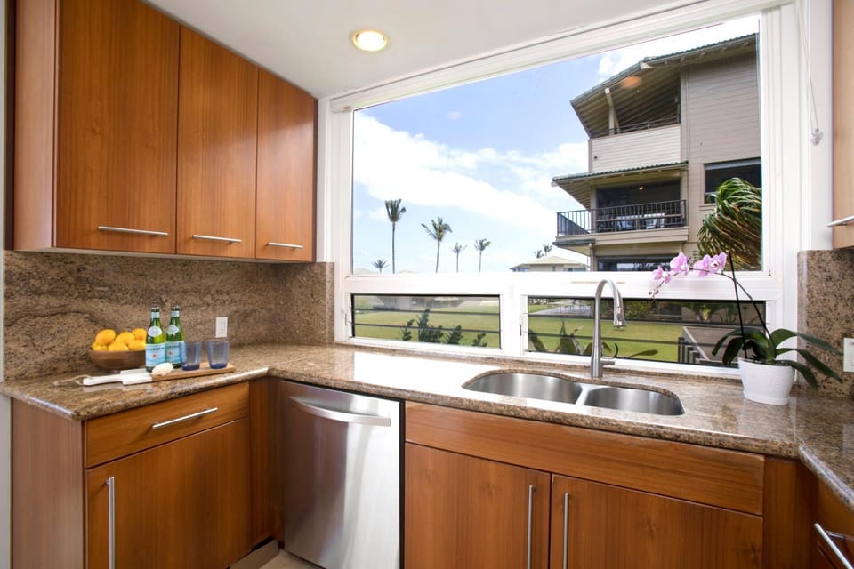  Stainless steel meets tropical feel—this kitchen is ready for your next recipe or a lazy snack break with a breeze    KBV-31G4