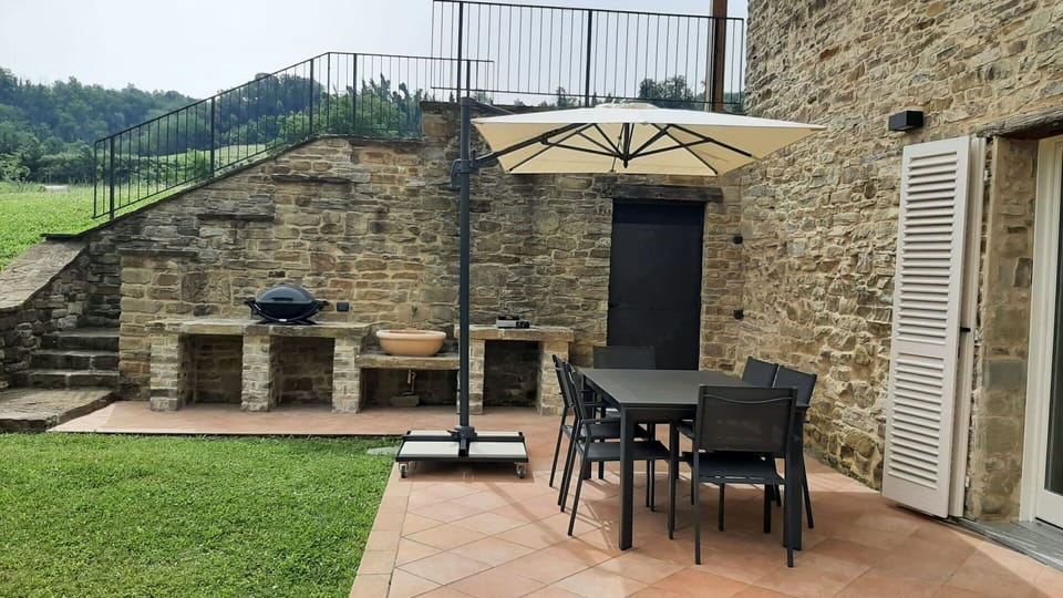 Furniture, Outdoor Furniture, Flooring, Chair, Table, Outdoor Table, Flagstone, Shade, Backyard, Patio