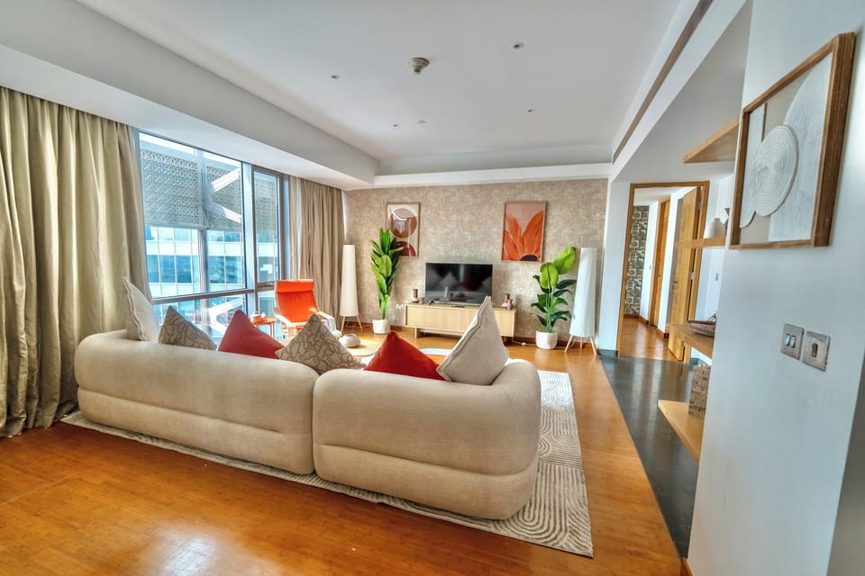 Premium Apartment, City View | Living area | 80-inch Smart TV with digital channels